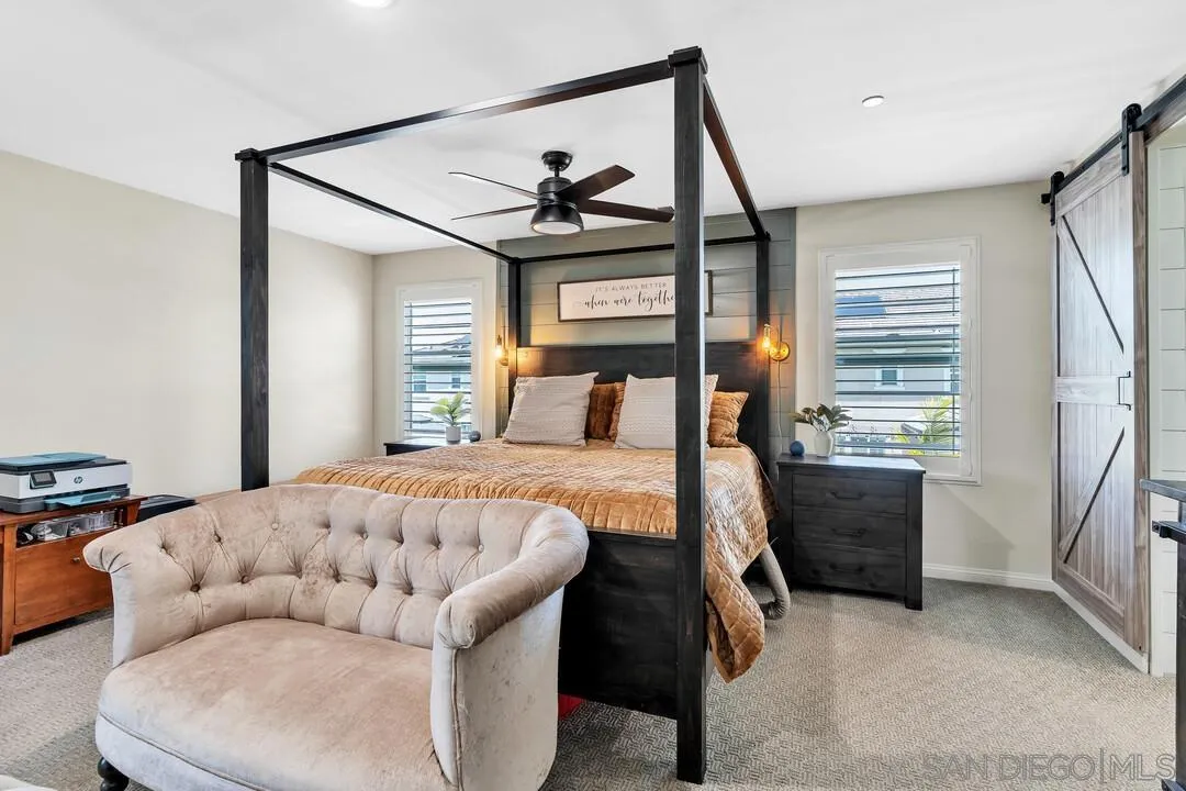 10700 Spring Creek Drive Santee, CA 92071 - Photo 34 of 74 a bedroom with a bed and a dresser next to a window