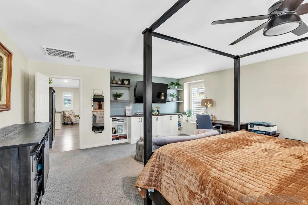 10700 Spring Creek Drive Santee, CA 92071 - Photo 35 of 74 a bed room with a bed and a television