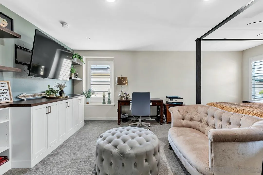 10700 Spring Creek Drive Santee, CA 92071 - Photo 36 of 74 a spacious bedroom with a bed a couch and dresser