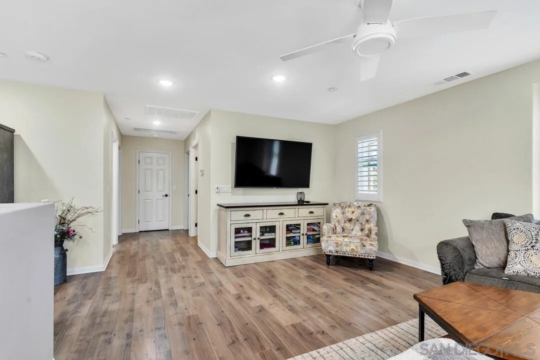 10700 Spring Creek Drive Santee, CA 92071 - Photo 43 of 74 a living room with furniture and a flat screen tv