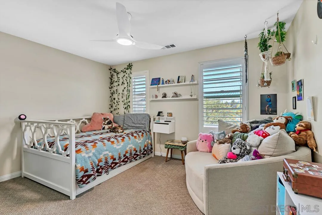 10700 Spring Creek Drive Santee, CA 92071 - Photo 47 of 74 a bedroom with a bed and a window