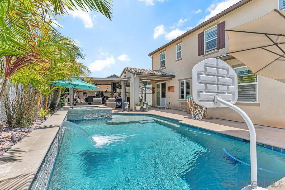 10700 Spring Creek Drive Santee, CA 92071 - Photo 52 of 74 a view of a house with a yard patio and swimming pool