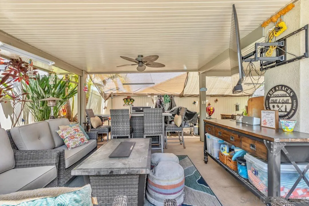 10700 Spring Creek Drive Santee, CA 92071 - Photo 55 of 74 a living room with furniture and a painting on the wall