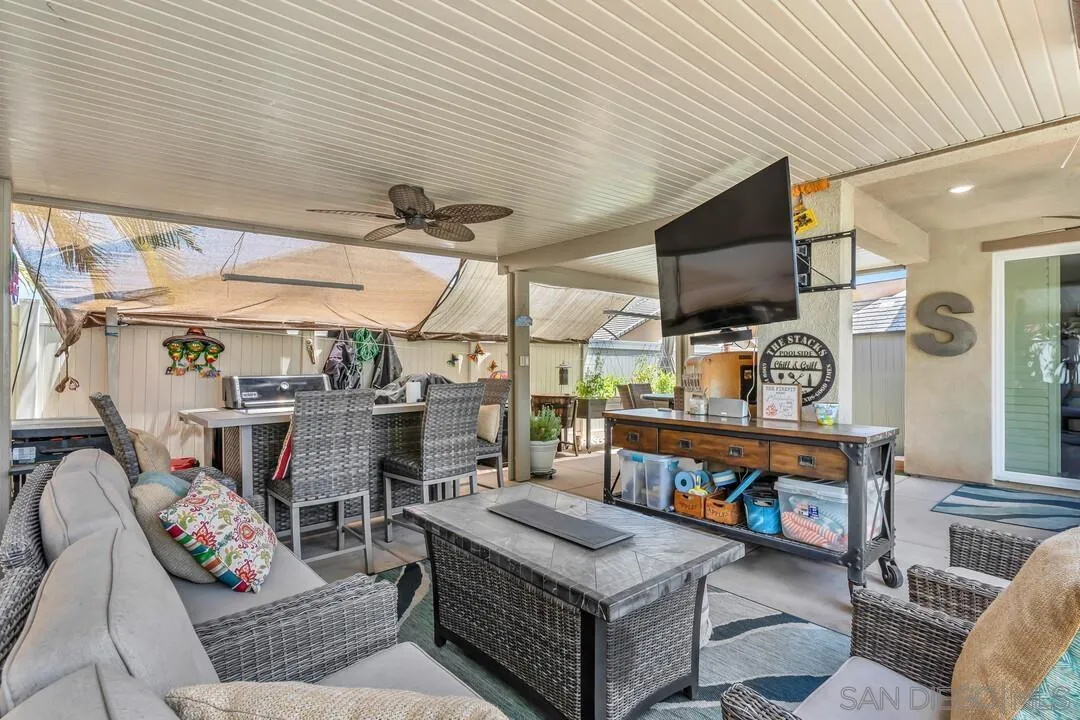 10700 Spring Creek Drive Santee, CA 92071 - Photo 56 of 74 a living room with furniture and a flat screen tv