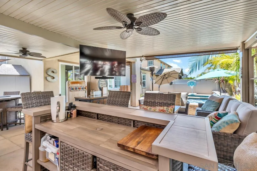 10700 Spring Creek Drive Santee, CA 92071 - Photo 60 of 74 a living room with stainless steel appliances kitchen island granite countertop furniture and a large window