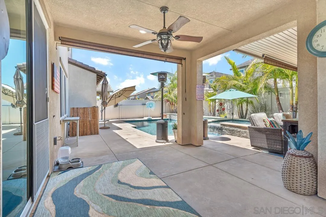 10700 Spring Creek Drive Santee, CA 92071 - Photo 66 of 74 a living room with furniture and a large window with garden view