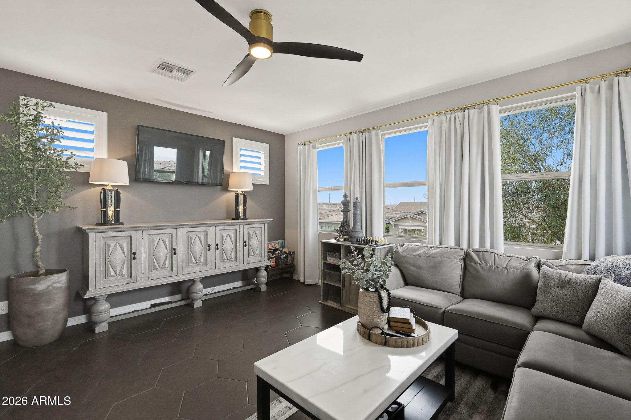 22607 East Russet Road Queen Creek, AZ 85142 - Photo 36 of 64 a living room with furniture ceiling fan and a window