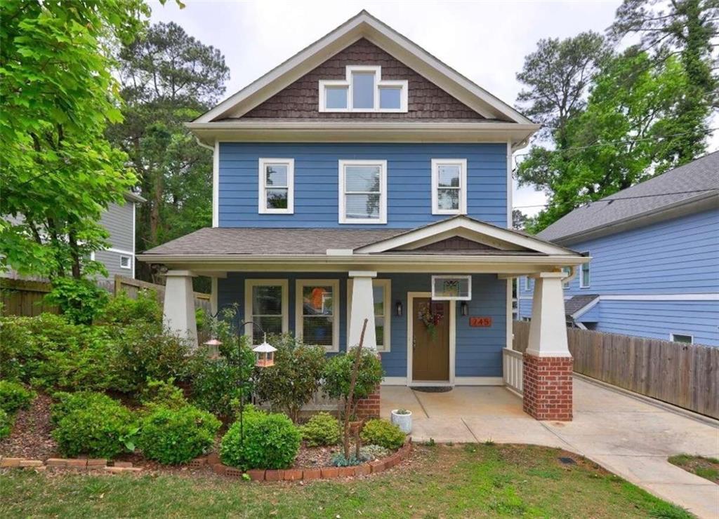 745 Reverend D L Edwards Drive Decatur, GA 30033 - Photo 1 of 1 a front view of a house with yard and green space