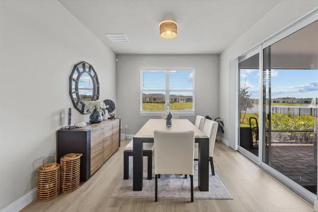 a view of a dining room with furniture window and outside view