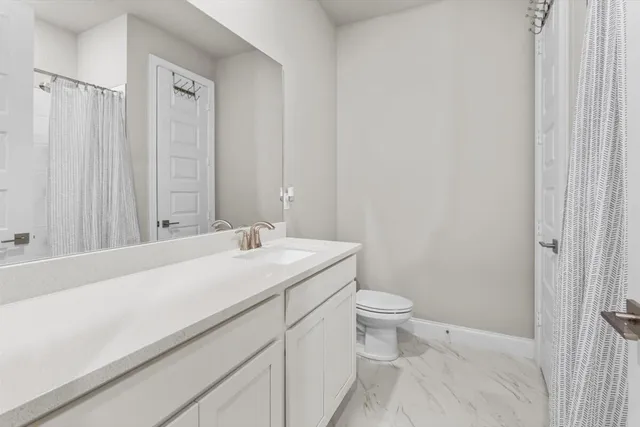 a bathroom with a sink and a toilet