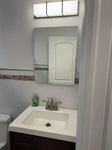 a bathroom with a sink and a toilet