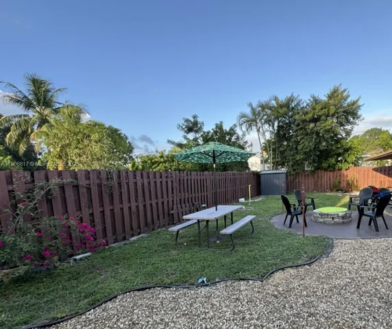 a view of a yard with furniture and a small yard