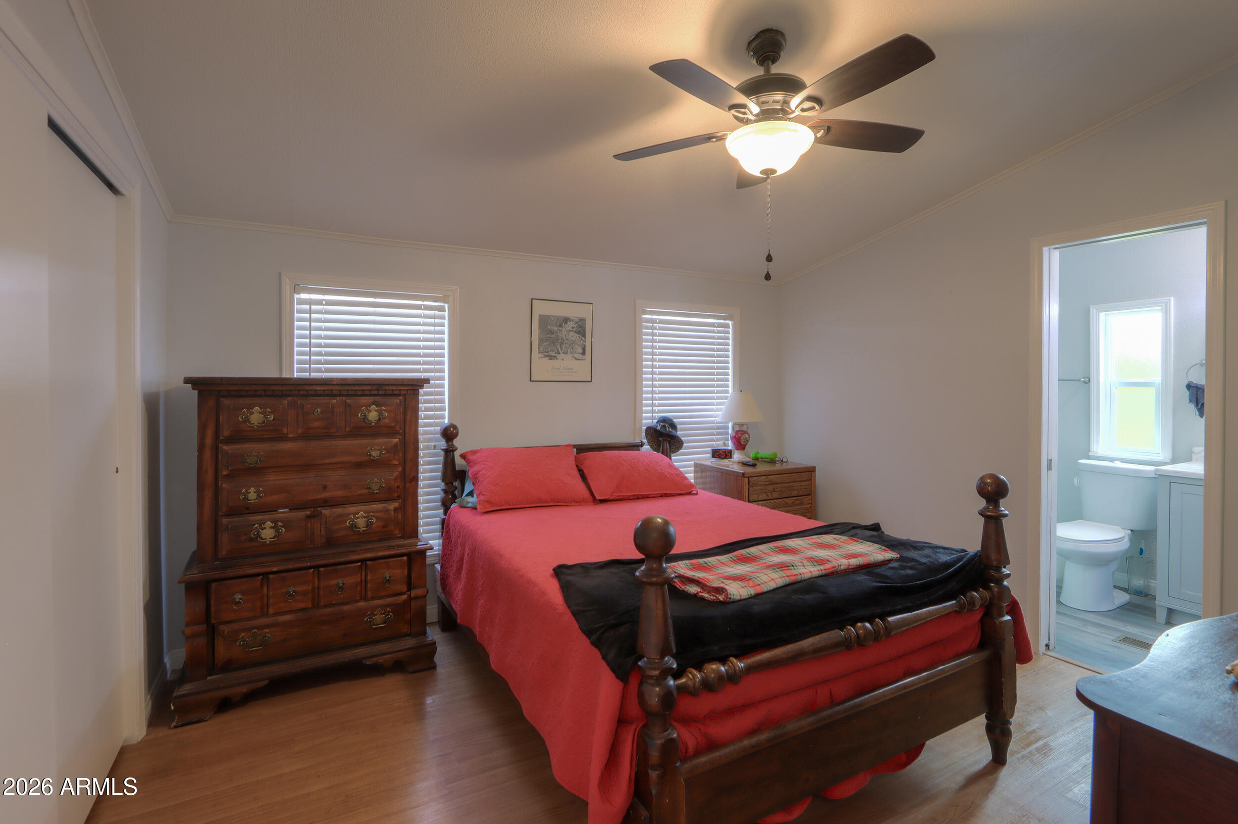 2100 North Trekell Road, Unit 290 Casa Grande, AZ 85122 - Photo 22 of 35 a bedroom with a bed and a ceiling fan