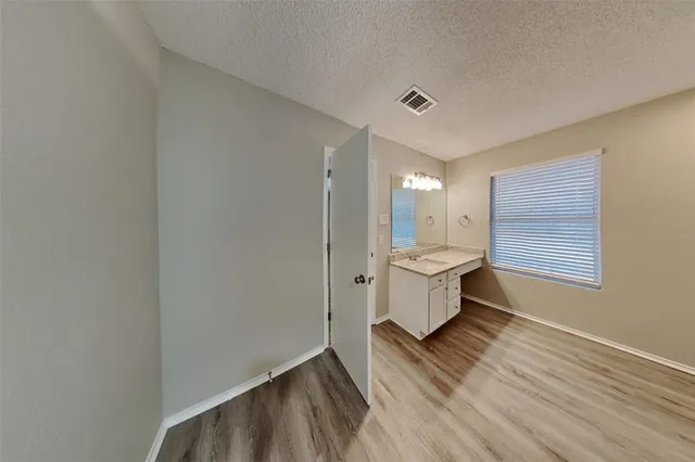 a bathroom with a sink mirror toilet and bathtub
