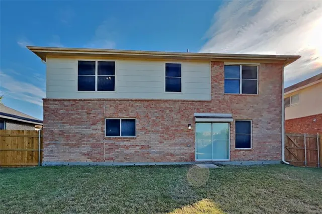 a brick house with a small yard