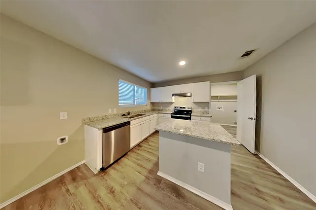a large kitchen with a lot of counter space