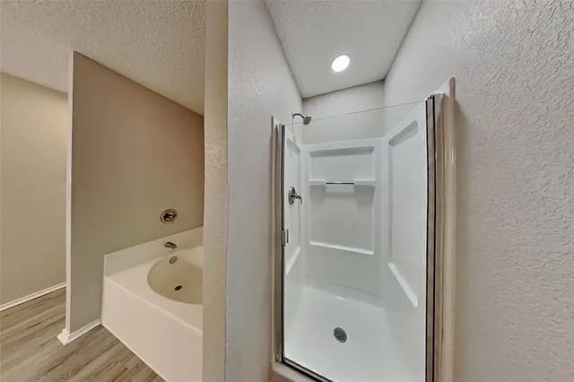 a bathroom with a tub and a sink