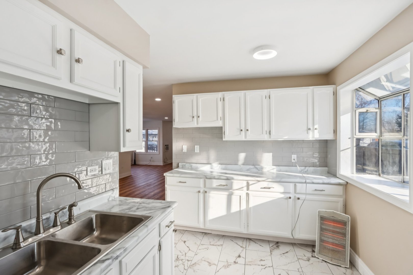 26814 North Genesee Street Wauconda, IL 60084 - Photo 10 of 34 a kitchen with kitchen island granite countertop a sink appliances cabinets and a counter top space