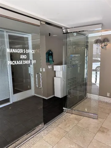 a bathroom with a glass shower door and a bathtub
