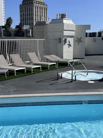 a view of a terrace with wooden floor and a bench