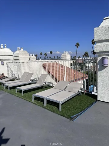a view of outdoor space with seating area and barbeque oven in the back