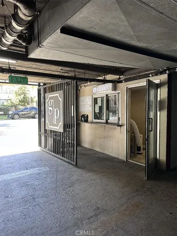 a view of a hallway with wooden floor and a fireplace