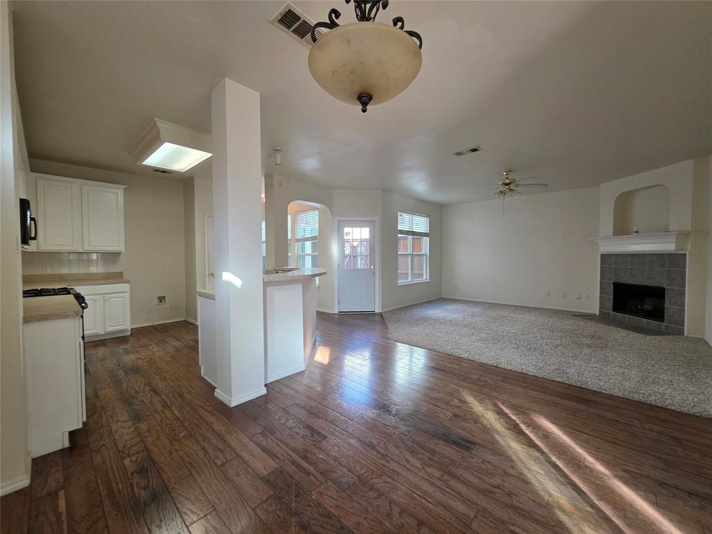 5413 Redwater Court The Colony, TX 75056 - Photo 14 of 40 a view of a kitchen and an empty room