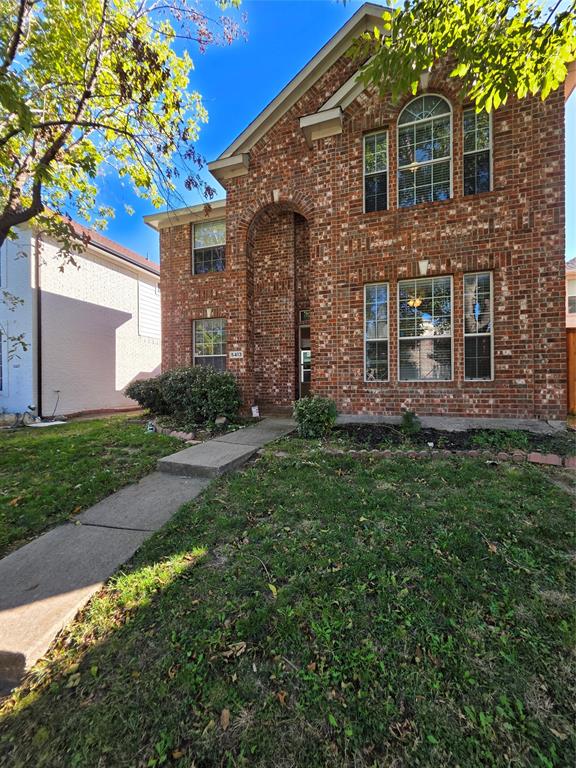 5413 Redwater Court The Colony, TX 75056 - Photo 2 of 40 a front view of a house with garden