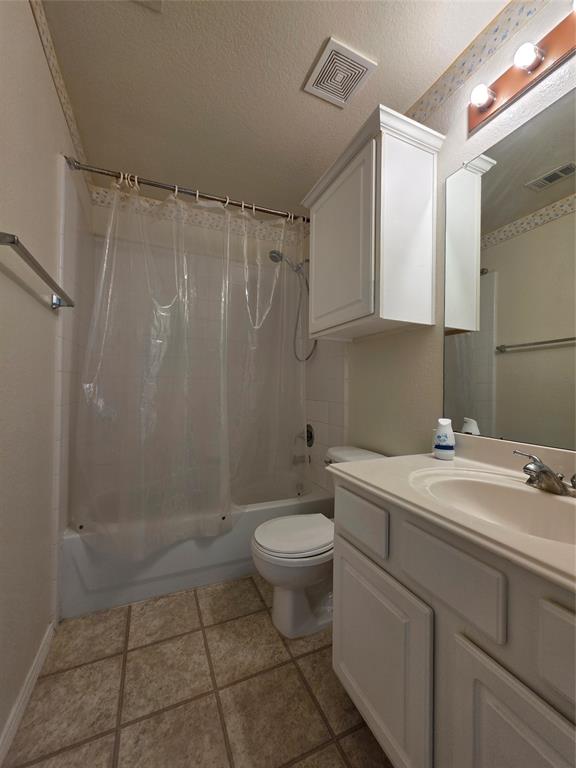 5413 Redwater Court The Colony, TX 75056 - Photo 22 of 40 a bathroom with a sink a toilet and shower