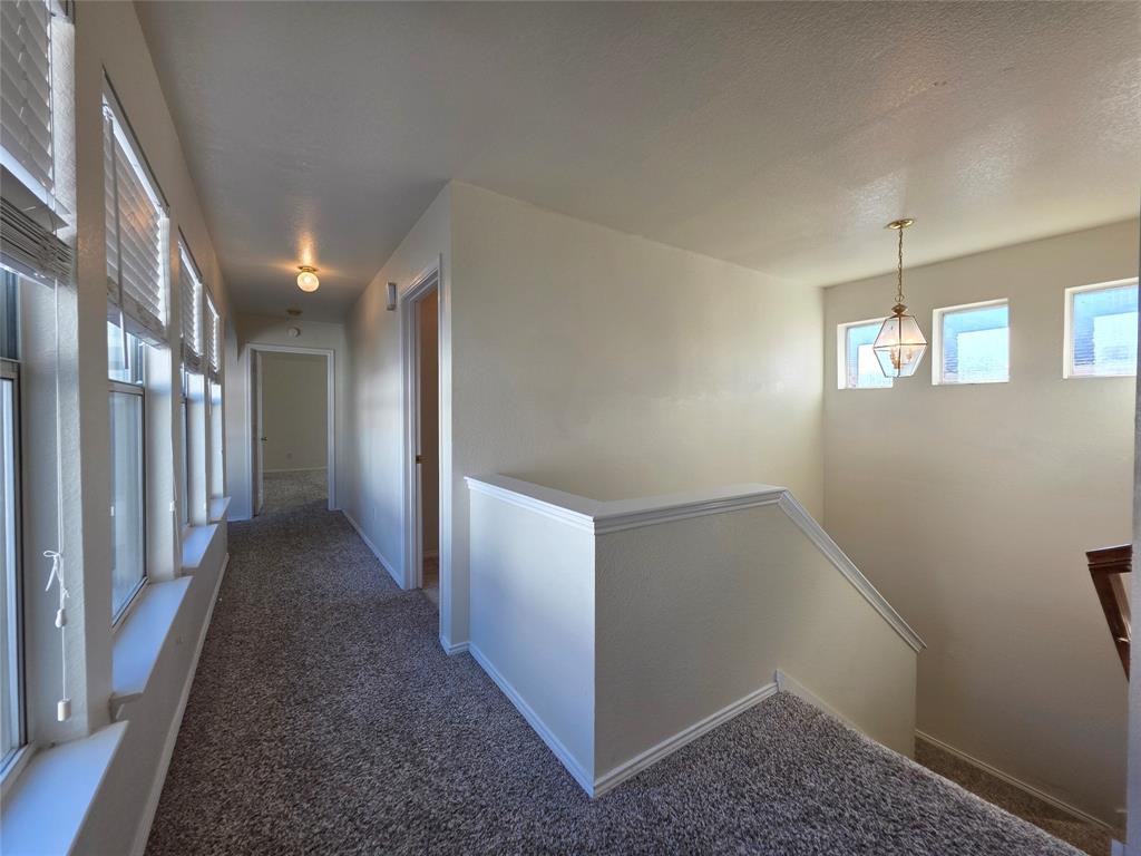 5413 Redwater Court The Colony, TX 75056 - Photo 26 of 40 a view of a hallway with staircase