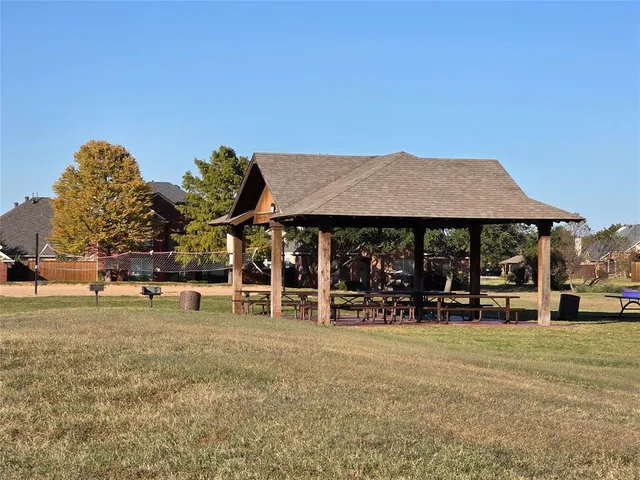 a view of a park with swings and slides
