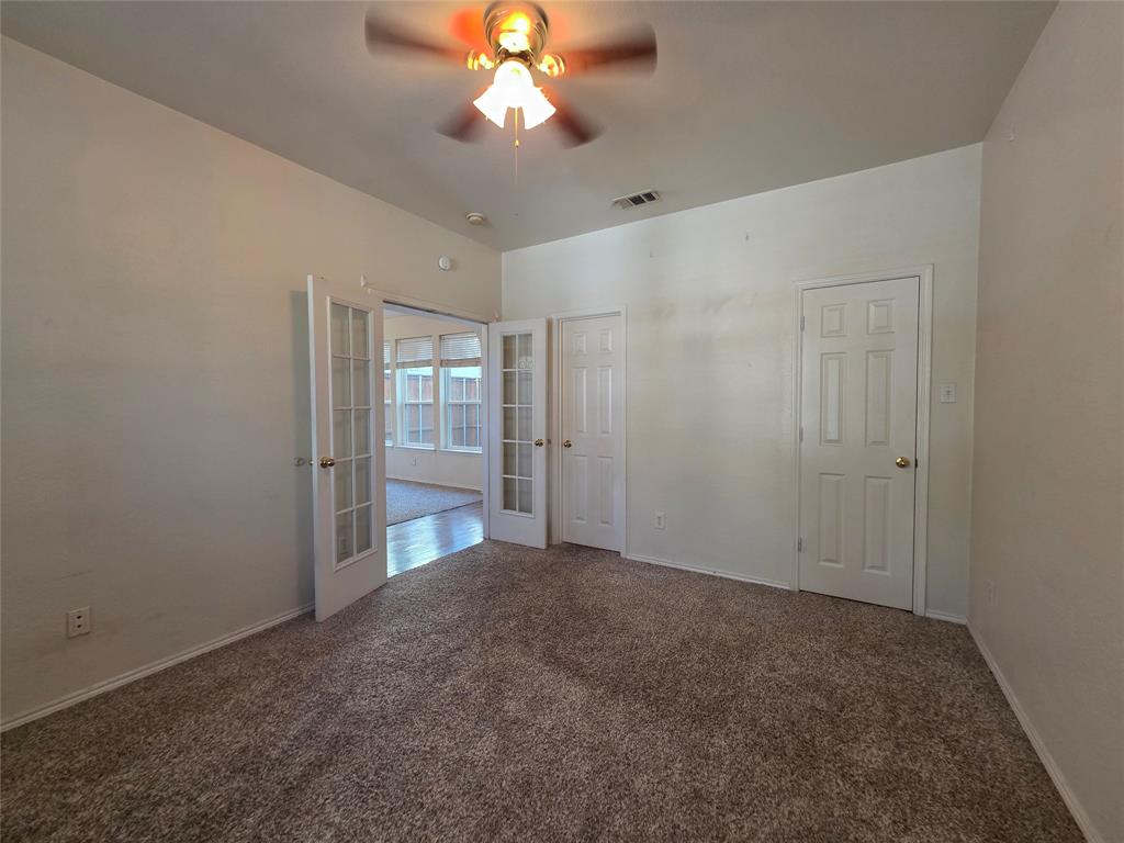 5413 Redwater Court The Colony, TX 75056 - Photo 9 of 40 a view of an empty room with a bathroom