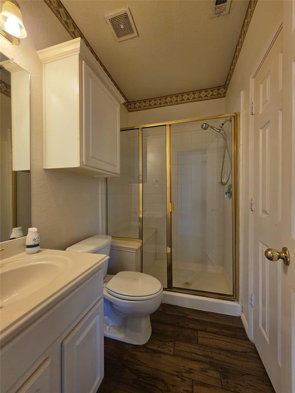 5413 Redwater Court The Colony, TX 75056 - Photo 10 of 40 a bathroom with a sink a toilet and shower