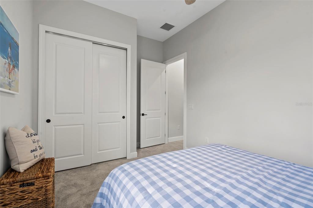 14560 Eagle Branch Drive Nokomis, FL 34275 - Photo 13 of 65 a bedroom with a bed and a window