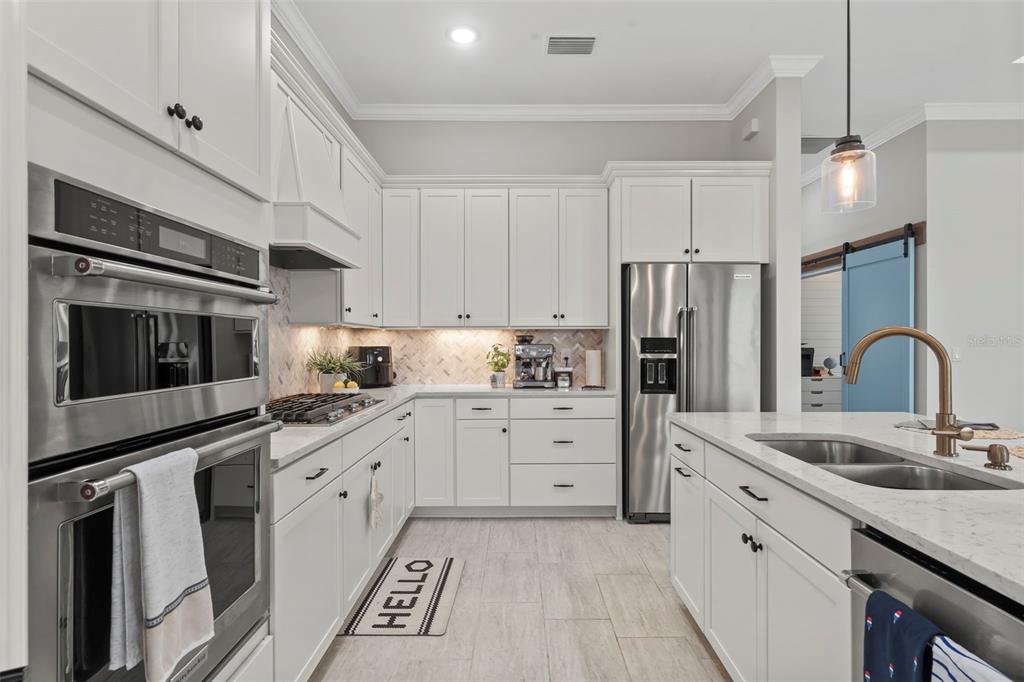 14560 Eagle Branch Drive Nokomis, FL 34275 - Photo 23 of 65 a kitchen with granite countertop cabinets stainless steel appliances and a sink