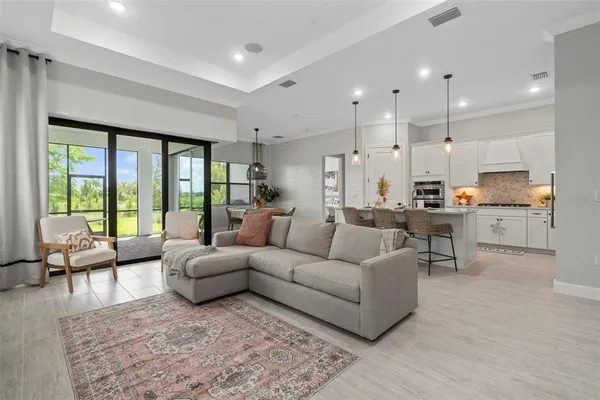 a en suite bathroom with a granite countertop double vanity sink and a mirror
