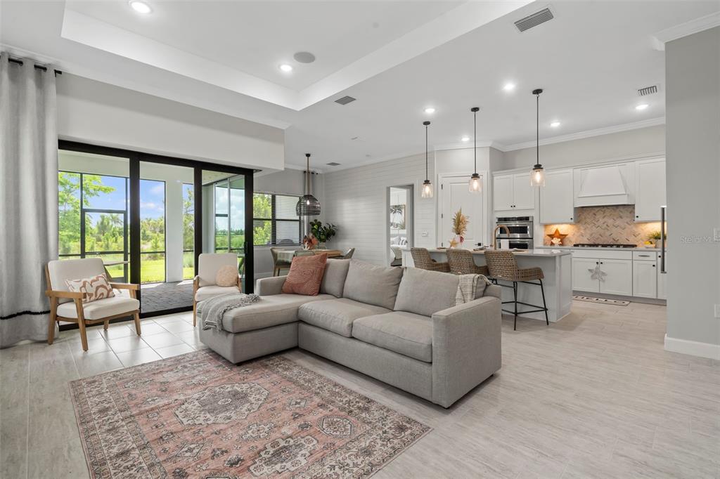 14560 Eagle Branch Drive Nokomis, FL 34275 - Photo 27 of 65 a living room with furniture and a large window