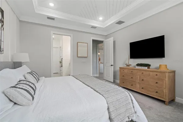 a kitchen with cabinets and a refrigerator