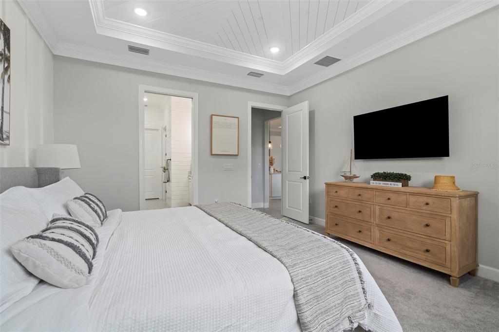 14560 Eagle Branch Drive Nokomis, FL 34275 - Photo 34 of 65 a bedroom with a bed and a flat screen tv