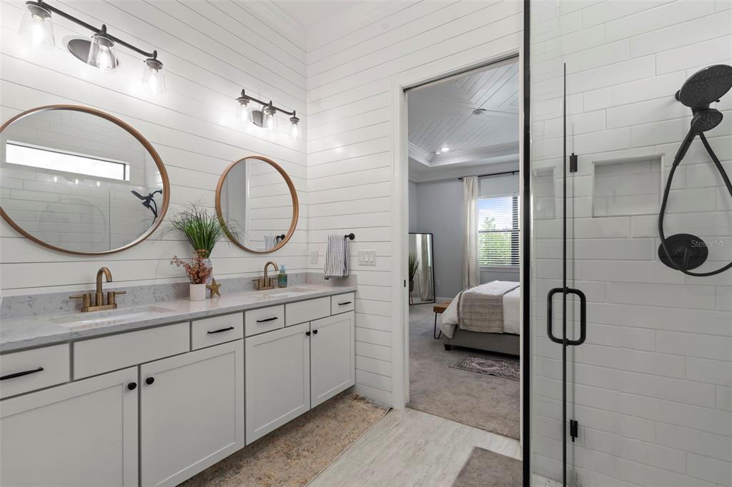 14560 Eagle Branch Drive Nokomis, FL 34275 - Photo 35 of 65 a en suite bathroom with a granite countertop double vanity sink and a mirror