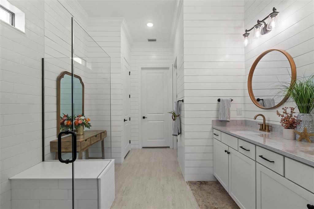 14560 Eagle Branch Drive Nokomis, FL 34275 - Photo 36 of 65 a bathroom with a sink double vanity and a mirror