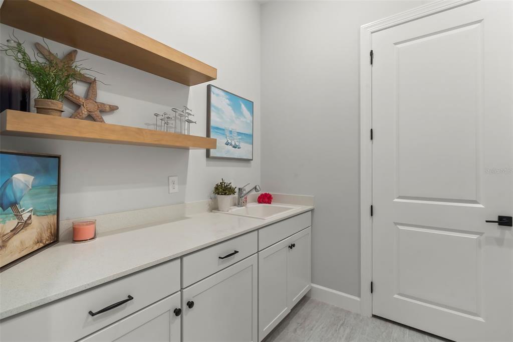 14560 Eagle Branch Drive Nokomis, FL 34275 - Photo 37 of 65 a kitchen with a sink and cabinets