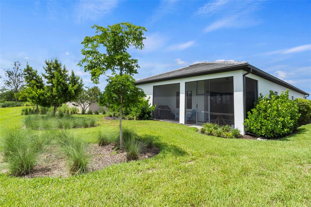 14560 Eagle Branch Drive Nokomis, FL 34275 - Photo 49 of 65 a view of a house with a yard