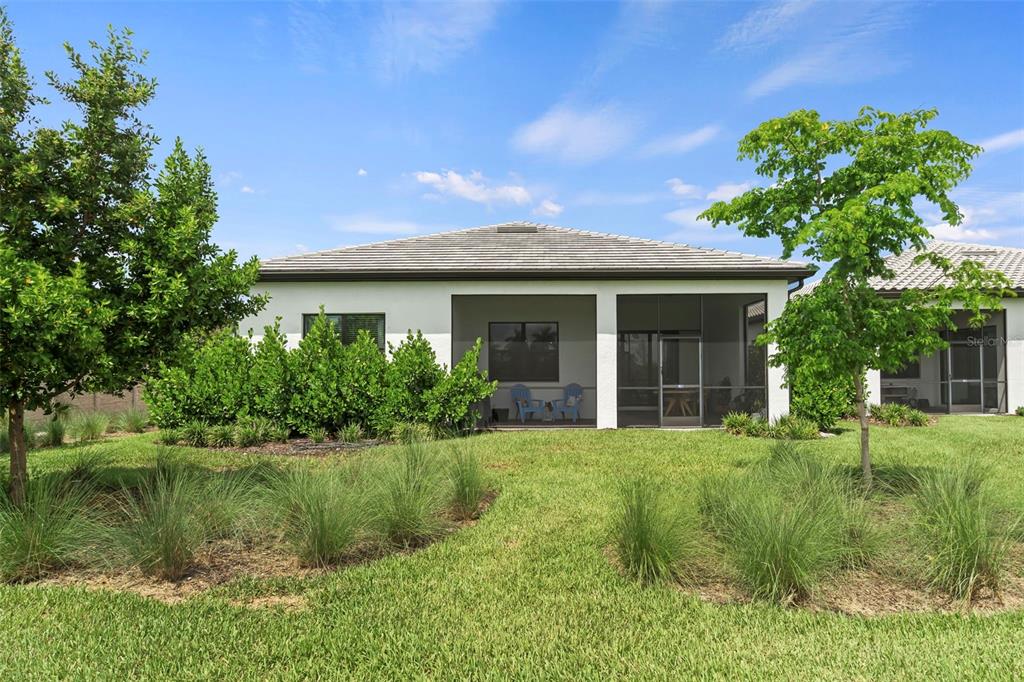 14560 Eagle Branch Drive Nokomis, FL 34275 - Photo 50 of 65 a front view of a house with a yard