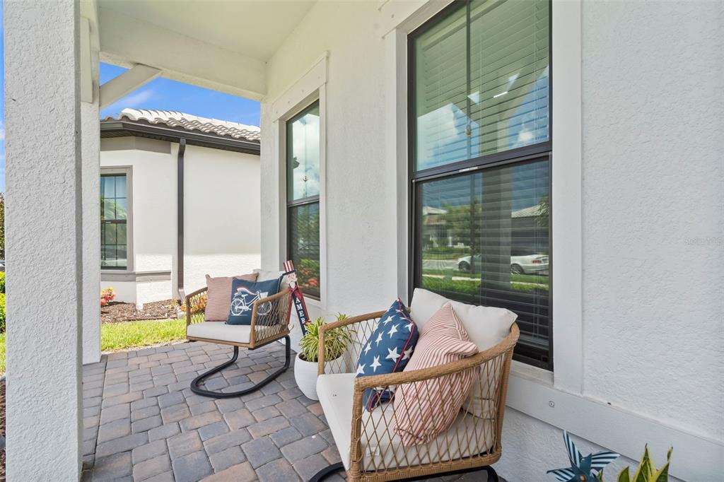 14560 Eagle Branch Drive Nokomis, FL 34275 - Photo 6 of 65 a living room with furniture and floor to ceiling window