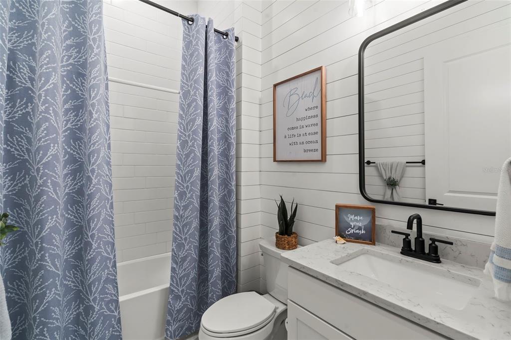 14560 Eagle Branch Drive Nokomis, FL 34275 - Photo 9 of 65 a bathroom with a granite countertop sink toilet and shower