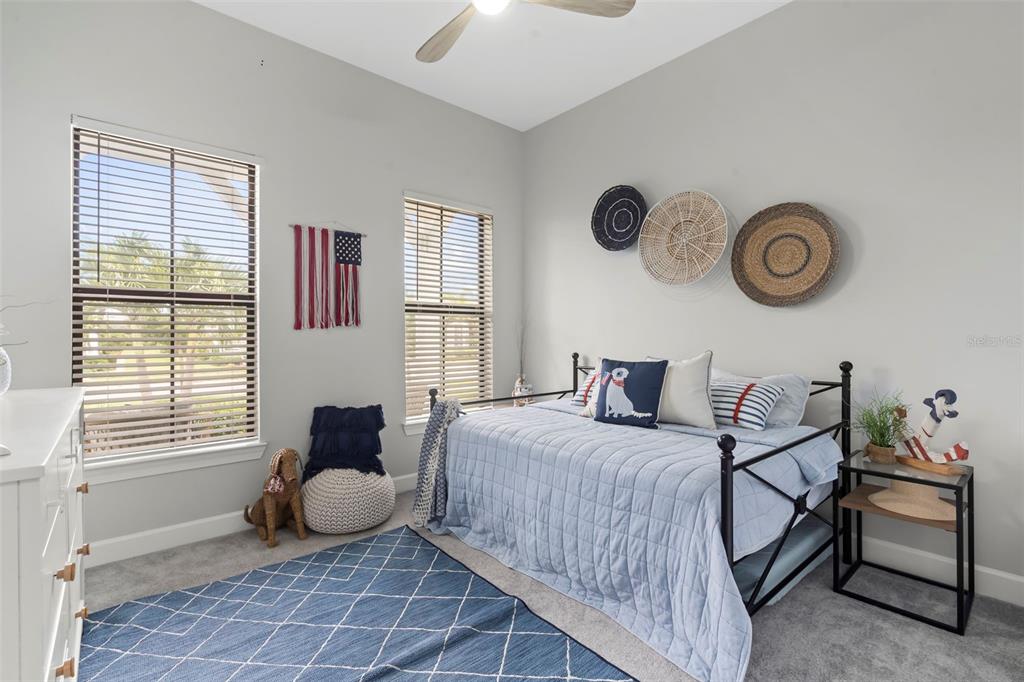 14560 Eagle Branch Drive Nokomis, FL 34275 - Photo 10 of 65 a bedroom with a bed and a window