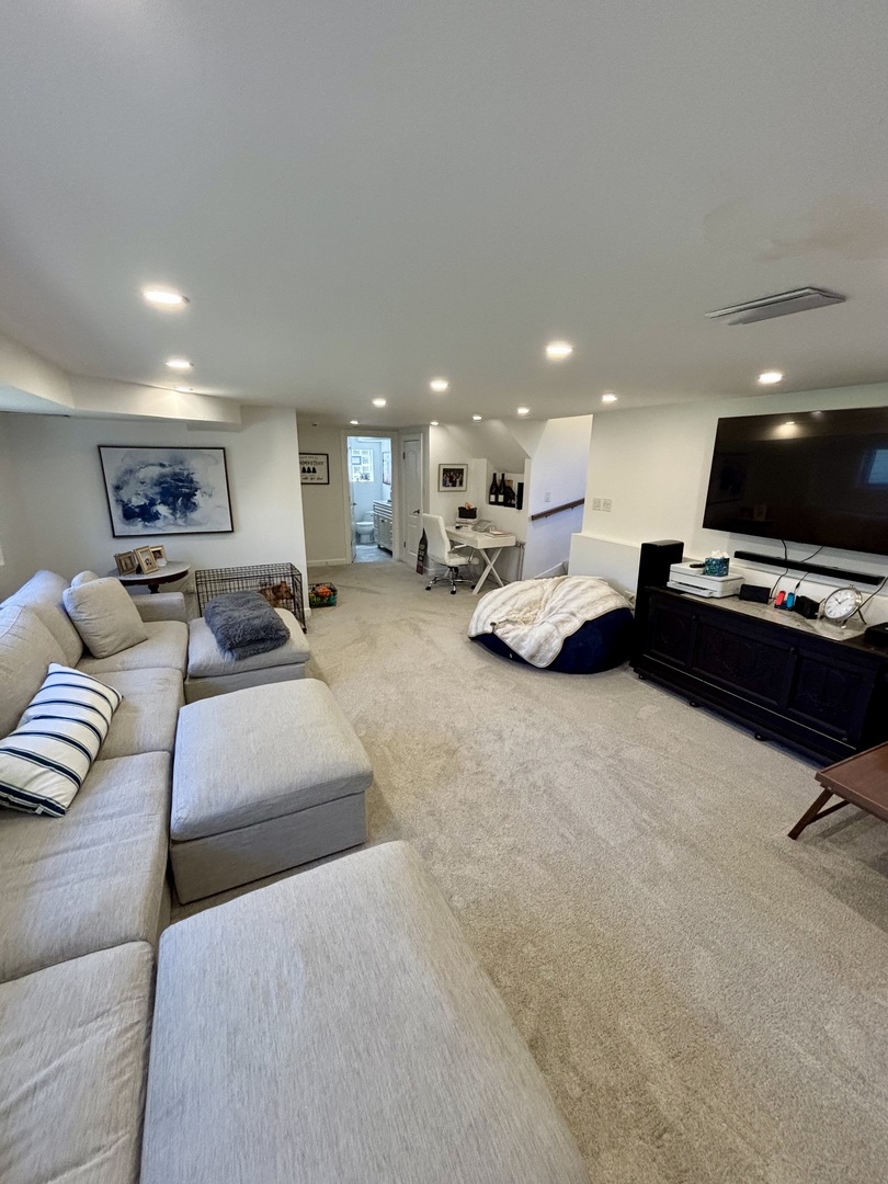 1237 Heatherfield Lane Glenview, IL 60025 - Photo 13 of 33 a living room with furniture and a flat screen tv