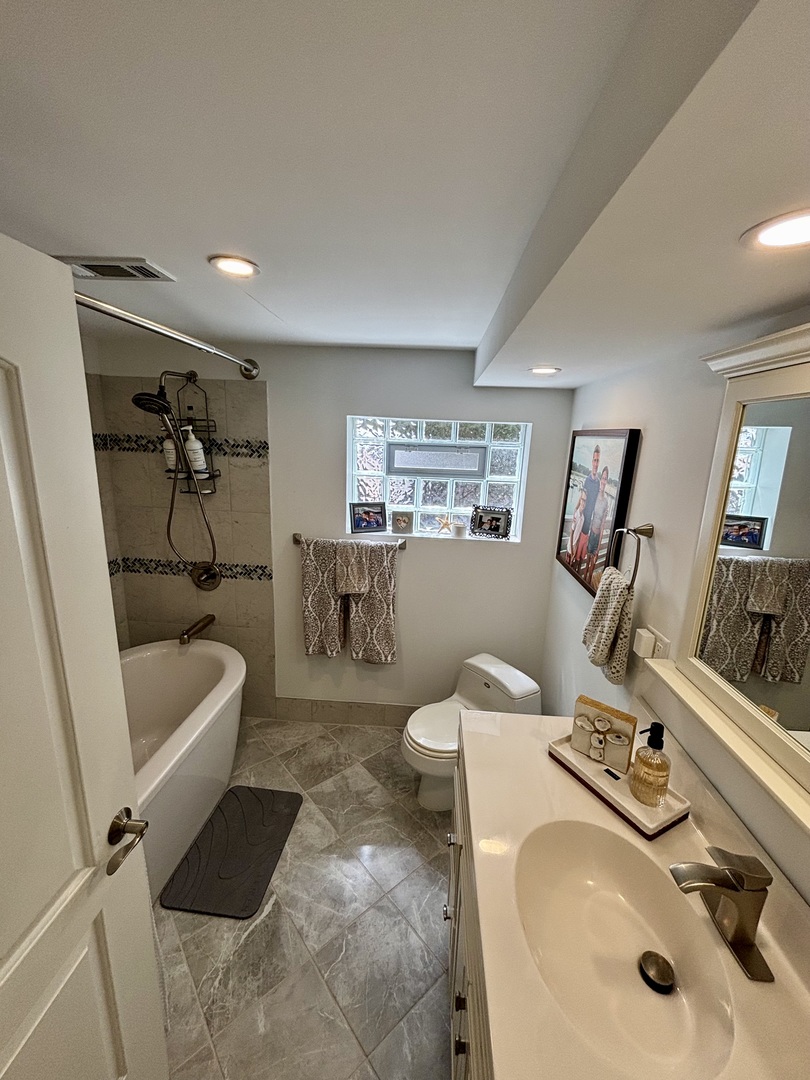 1237 Heatherfield Lane Glenview, IL 60025 - Photo 15 of 33 a bathroom with a sink a toilet and a mirror
