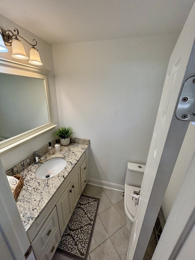 1237 Heatherfield Lane Glenview, IL 60025 - Photo 17 of 33 a bathroom with a sink and a mirror